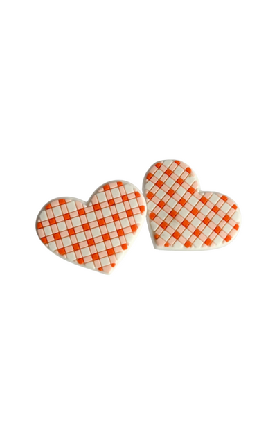 Pair of orange and white gingham heart-shaped boot buttons - a playful accessory perfect for Oklahoma State or Tennessee game day style.