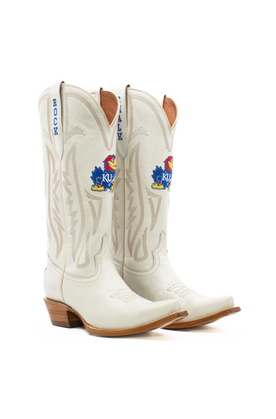 White leather western boots featuring the University of Kansas Jayhawks logo in red, blue, and yellow, with “ROCK CHALK” stitched on the pull tabs. Ideal for spirited KU fans looking to elevate their game day style.