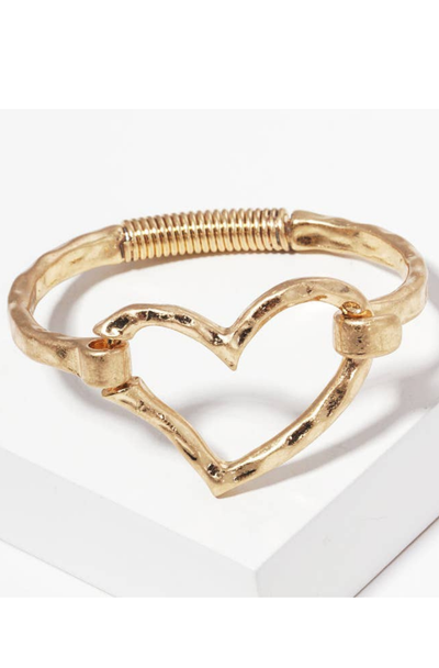 Gold heart-shaped bangle on a white background