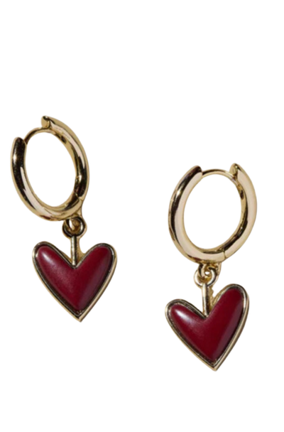 Gold hoop earrings with maroon heart charms on a white background