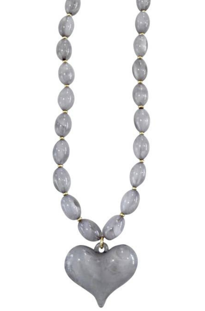 Necklace with gray heart pendant and beaded chain on a white background