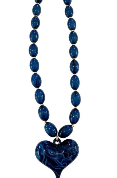 Navy blue beaded necklace with a heart-shaped pendant on a white background